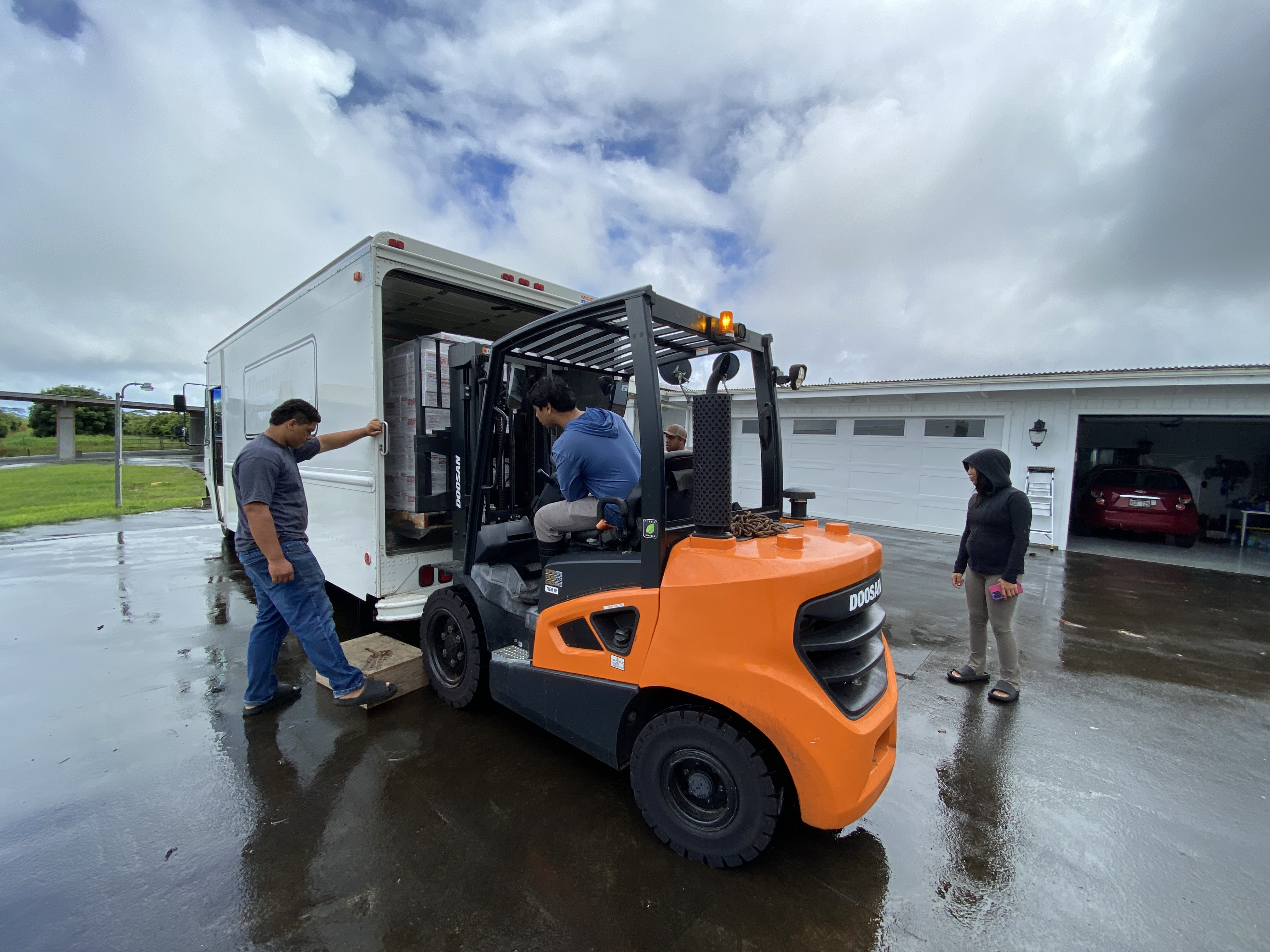 The longan donation being loaded into the Kaumahana Crew’s truck