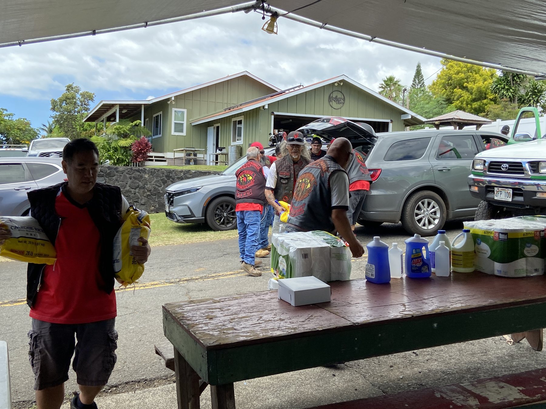 Volunteers carry donated supplies into the hub