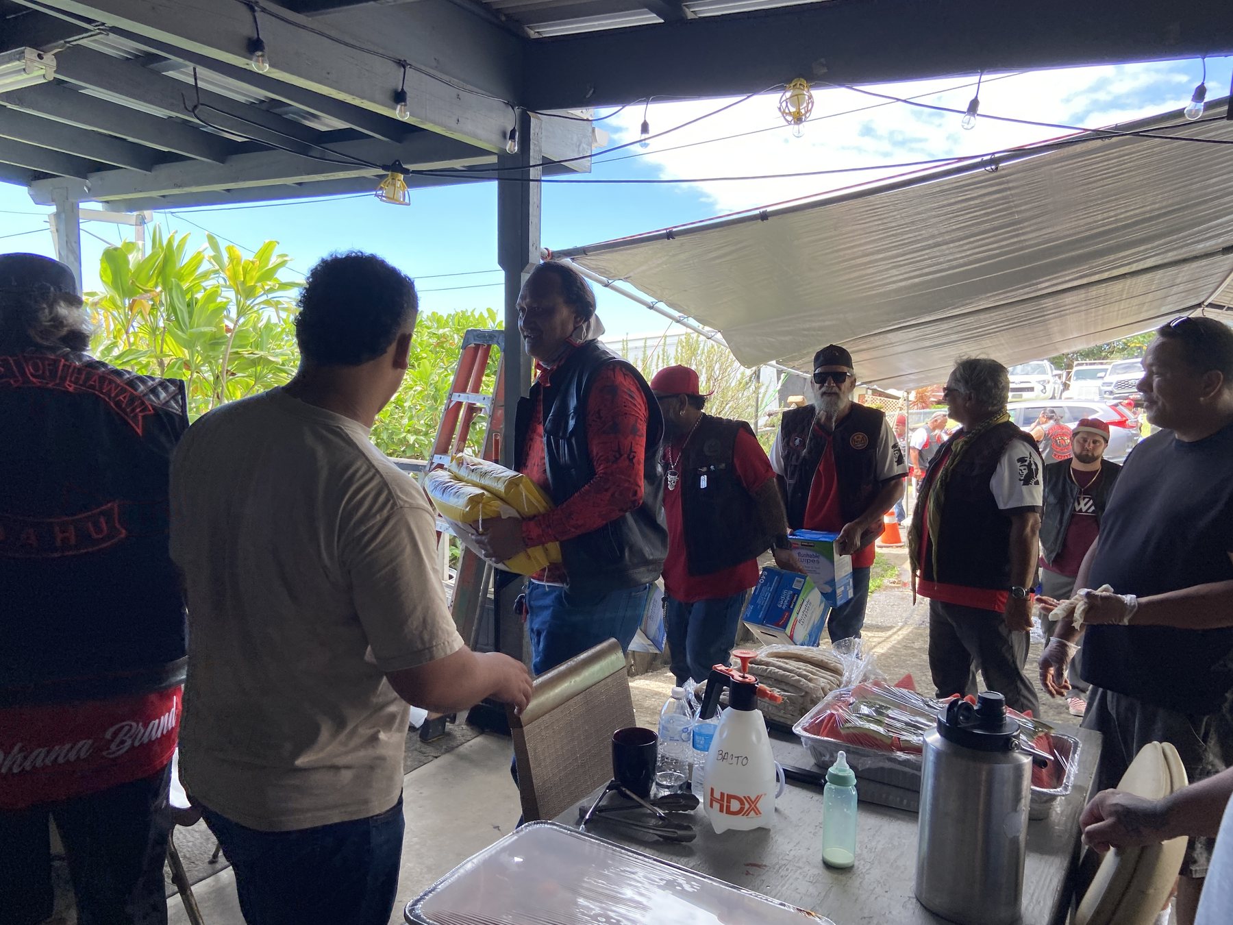 Community volunteers sort donations at the hub