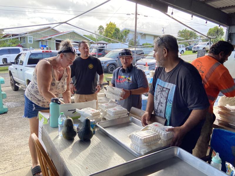 Volunteers pack meals for Pāhala families