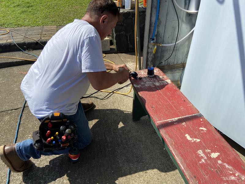 Braddah Ray Leota (Electrician) fixing out Plug to get the Ice Machine Working