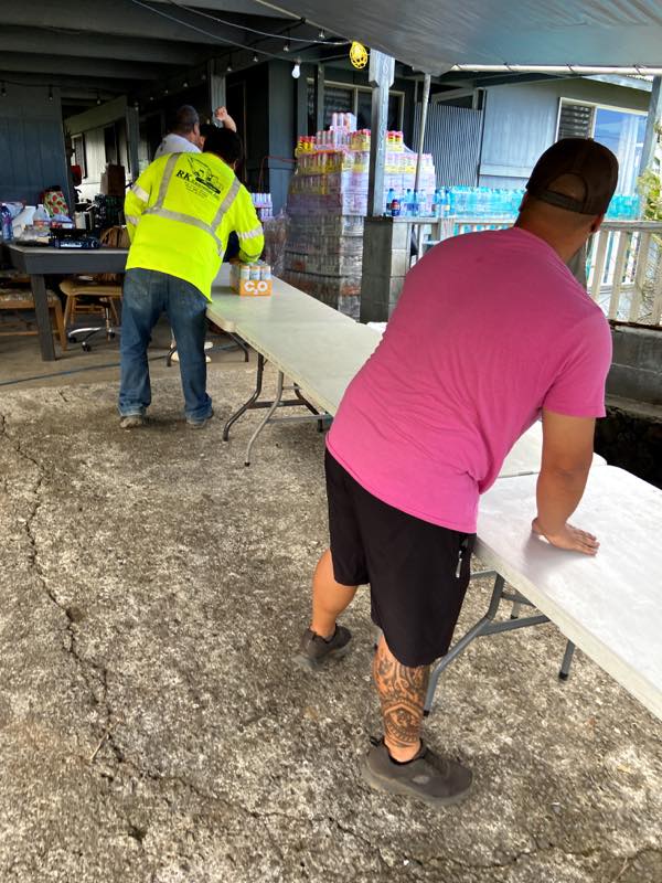Volunteers reset tables after distribution